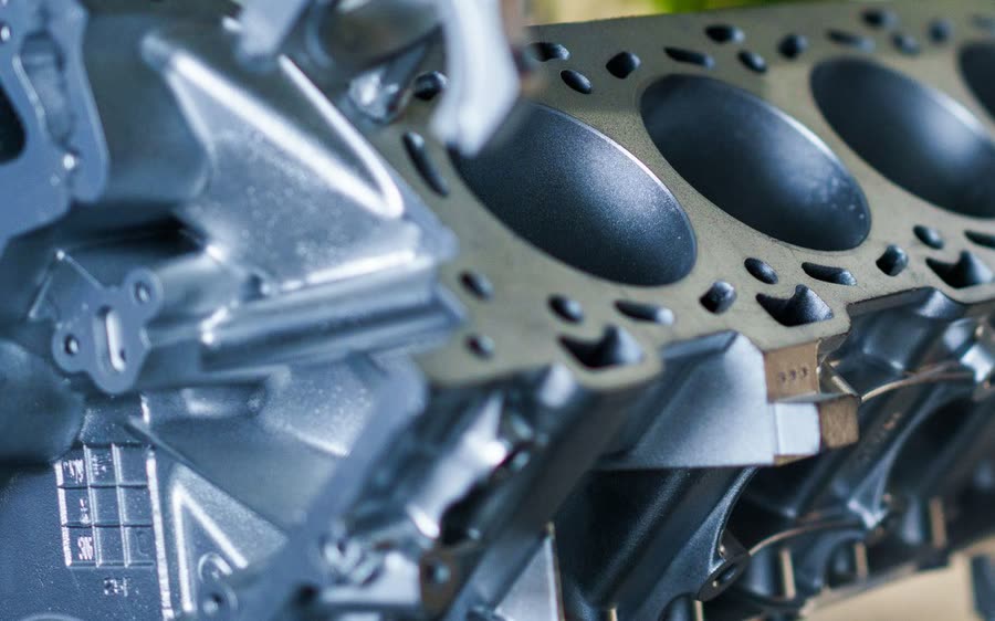 Machined deck face and cylinder bores of a cast aluminum engine block
